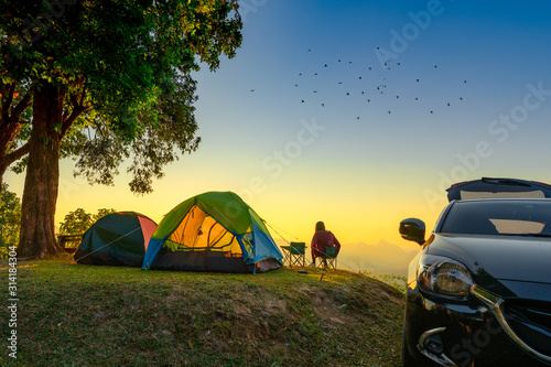 woman traveller camping in campsite with freshly morning action photo