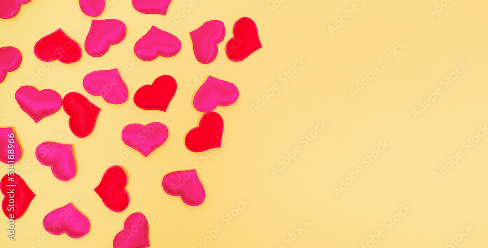 Hearts on yellow background. Valentine's day banner, 16x9. Copy space.