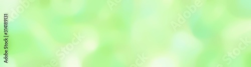 blurred horizontal background texture with tea green, beige and light golden rod yellow colors and free text space