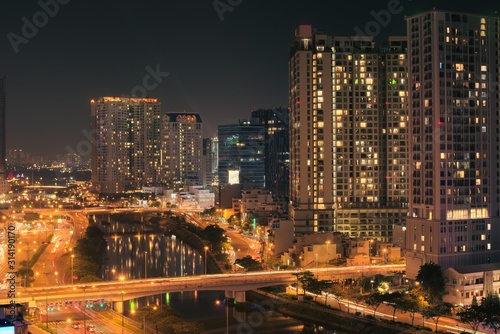 Busy avenue at night in Saigon, Vietnam (Ho Chi Minh City). Long exposure elevated view.