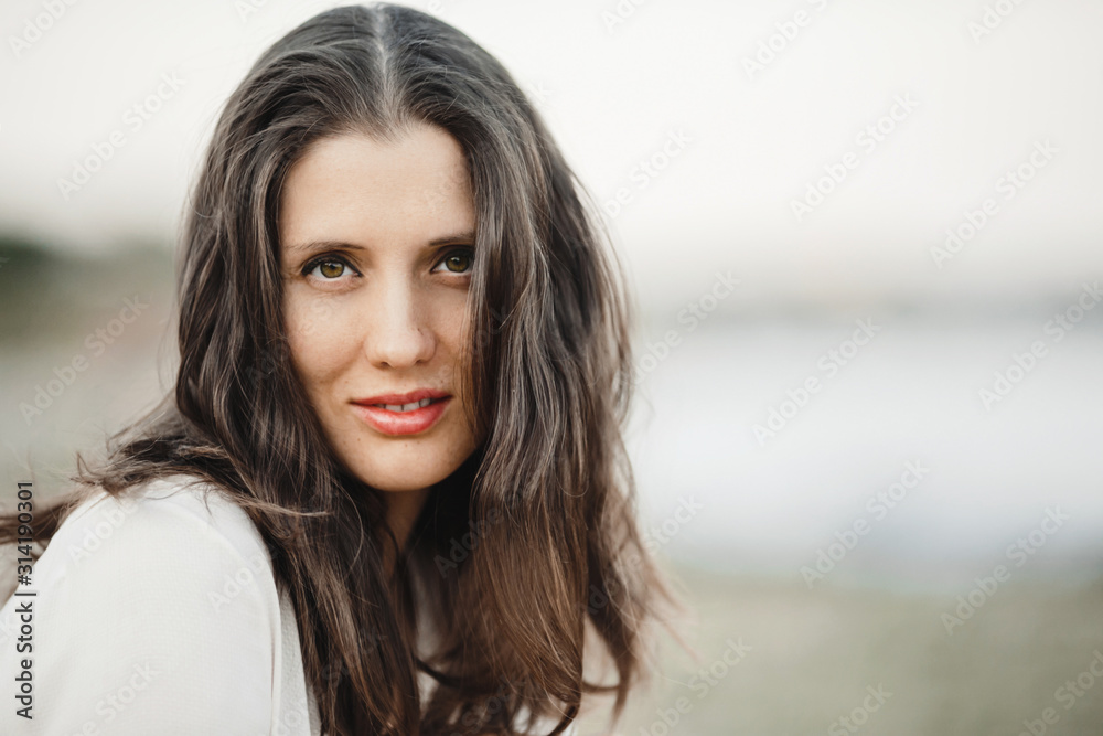 Beautiful woman portrait with long brunette hair