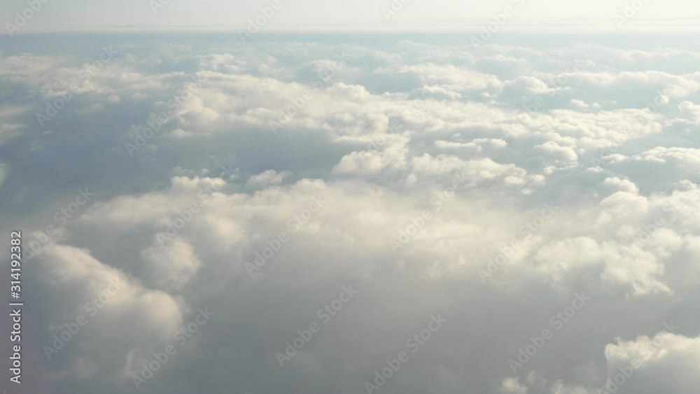 Flying over beautiful clouds at sunset. Amazing view Flying over beautiful clouds at sunset. Amazing view