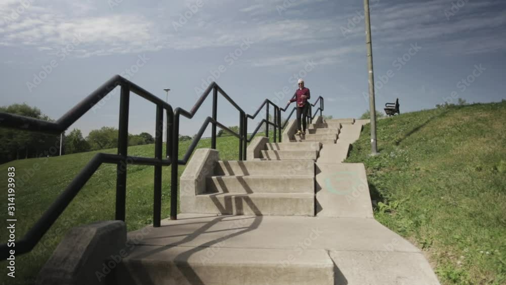 A Young Woman Working Out Outdoors Walking In A Stairway - Medium Shot A Young Woman Working Out Outdoors Walking In A Stairway - Medium Shot