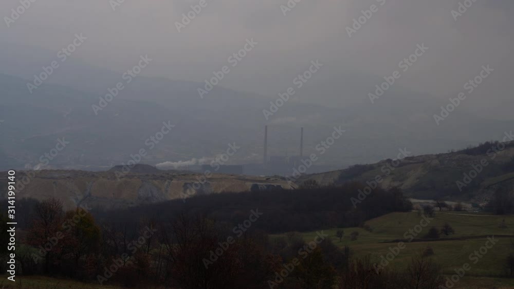 Industrial factory pollution atmosphere large smoke from chimneys near city unclean air poor visibility stuffy - (4K) Industrial factory pollution atmosphere large smoke from chimneys near city unclean air poor visibility stuffy - (4K)