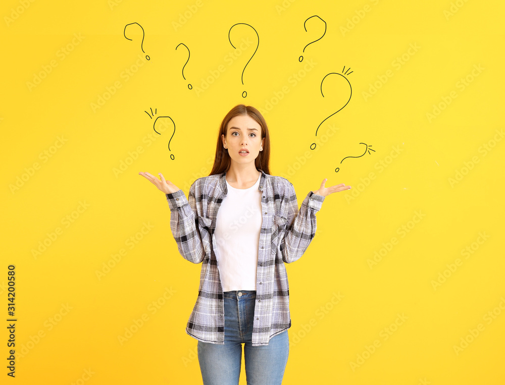 Fototapeta premium Helpless young woman on color background. Concept of choice