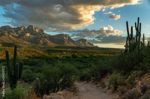 Golden hour, desert landscape, mountains photo