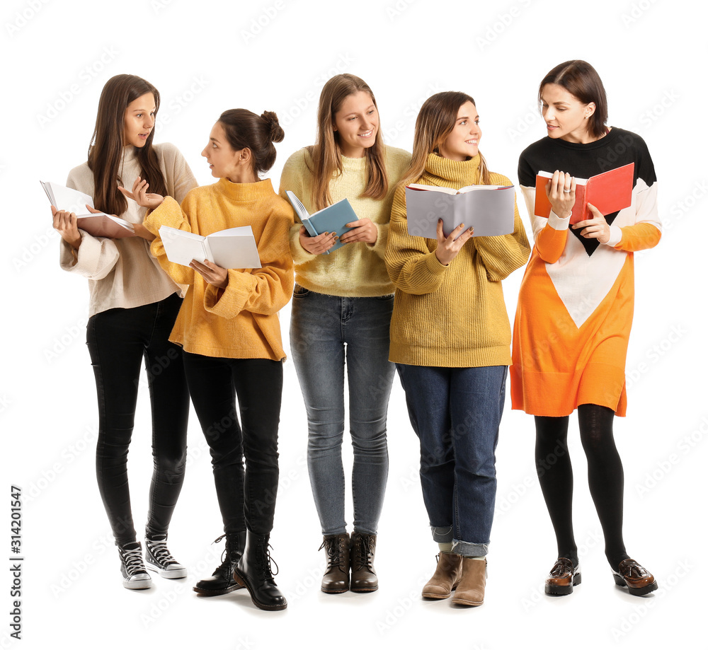 Young women with books on white background