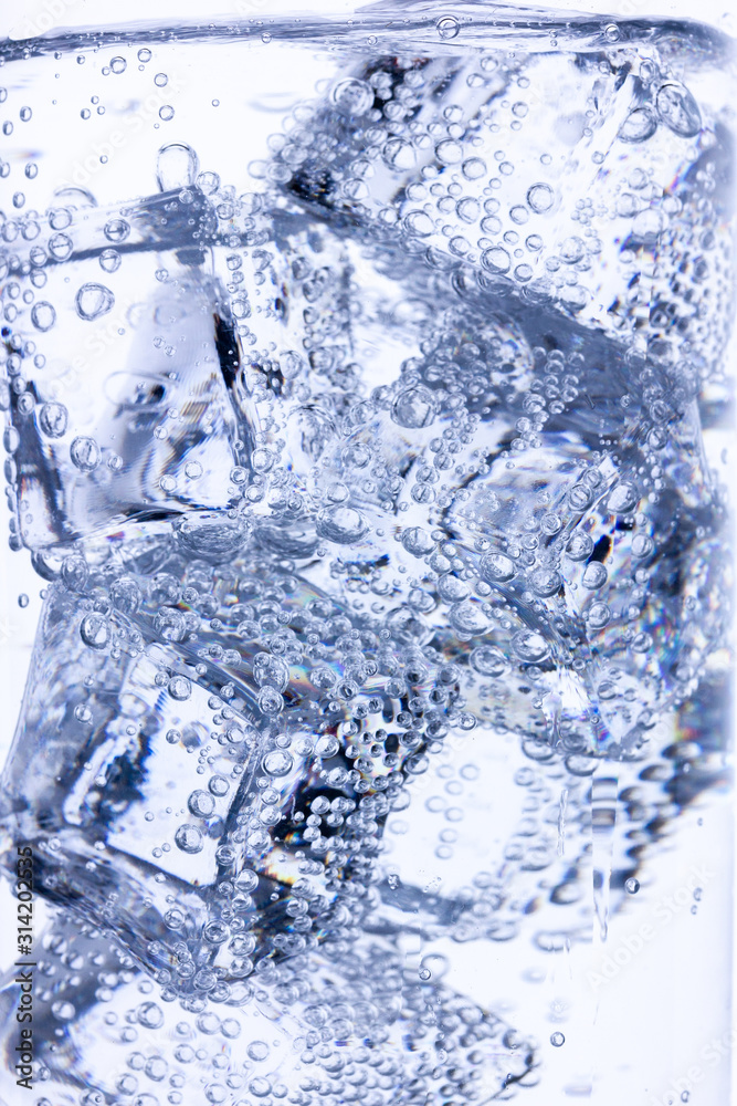 background of ice cubes doused with mineral water with air bubbles background of ice cubes doused with mineral water with air bubbles