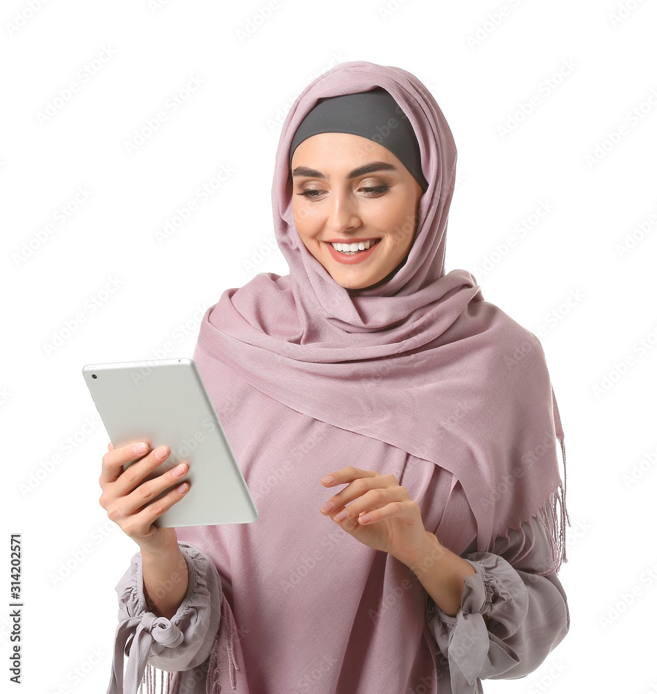 Beautiful Arab woman with tablet computer on white background Beautiful Arab woman with tablet computer on white background
