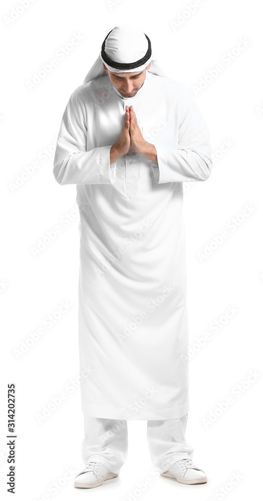 Handsome praying Arab man on white background Handsome praying Arab man on white background