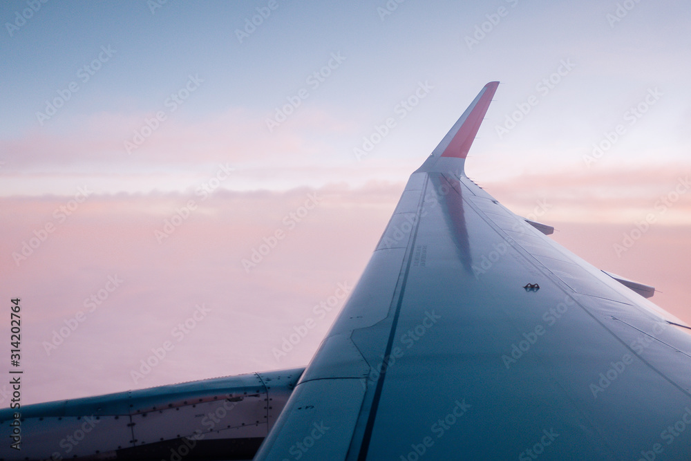 sunset sky as seen through window of an aircraft