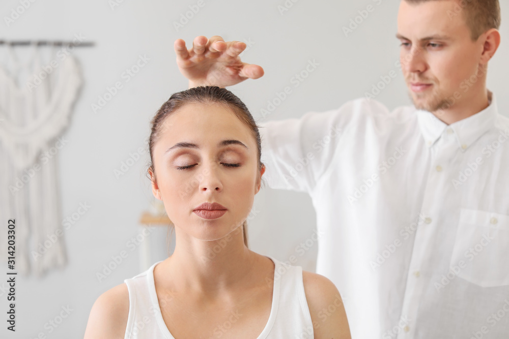 Reiki master working with patient Reiki master working with patient