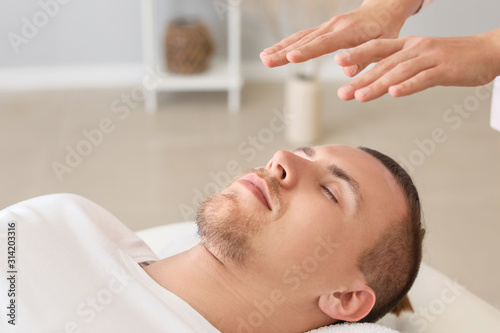 Reiki master working with patient