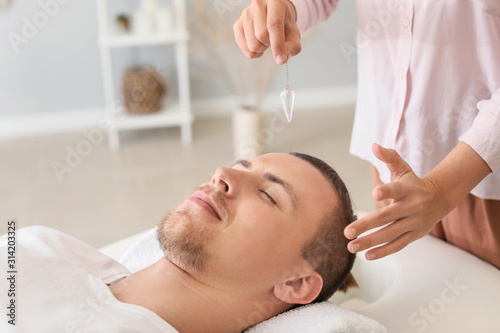 Reiki master working with patient