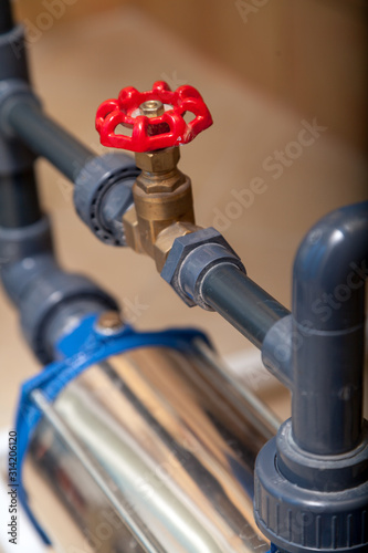 Close-up water tap on plastic pipe