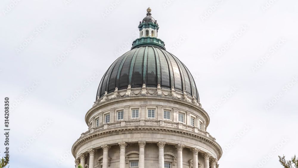 Panorama Famous dome of Utah State Capitol Building against cloudy sky in Salt Lake City
