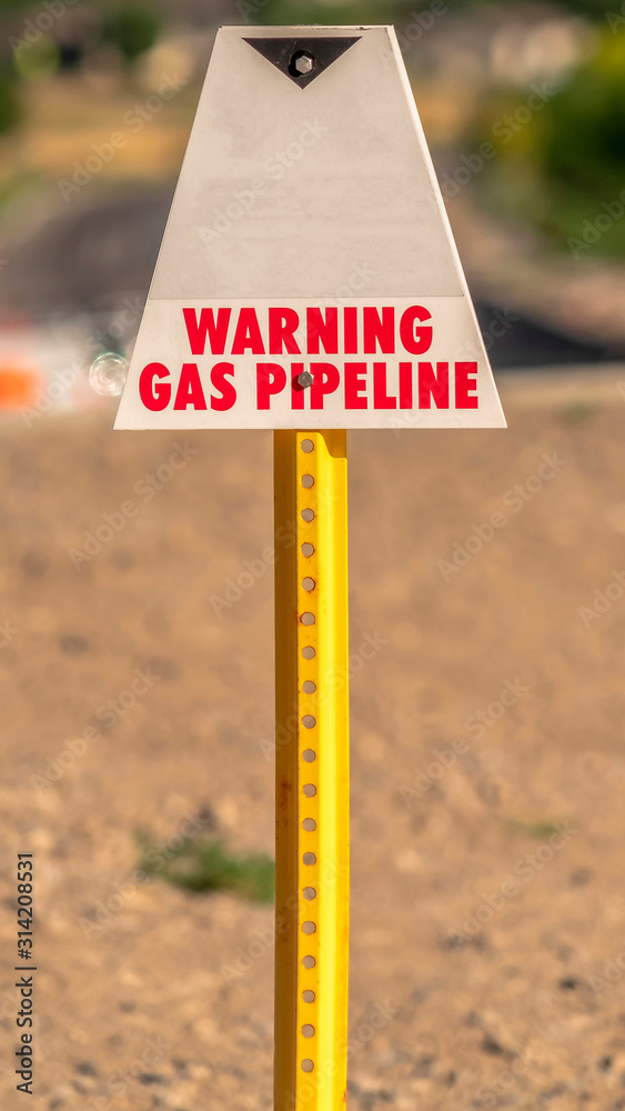 Vertical Selective focus of a Warning Gas Pipeline sign for security and safety