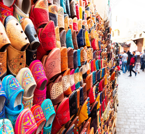Traditional vibrant Moroccan slippers - "babouches" on the market in Fez, Morocco.