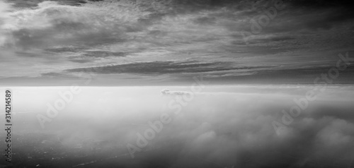foggy with sky, in black and white