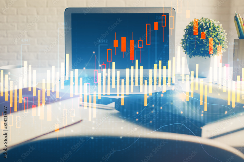 Stock market chart hologram drawn on personal computer background. Double exposure. Concept of investment. Stock market chart hologram drawn on personal computer background. Double exposure. Concept of investment.