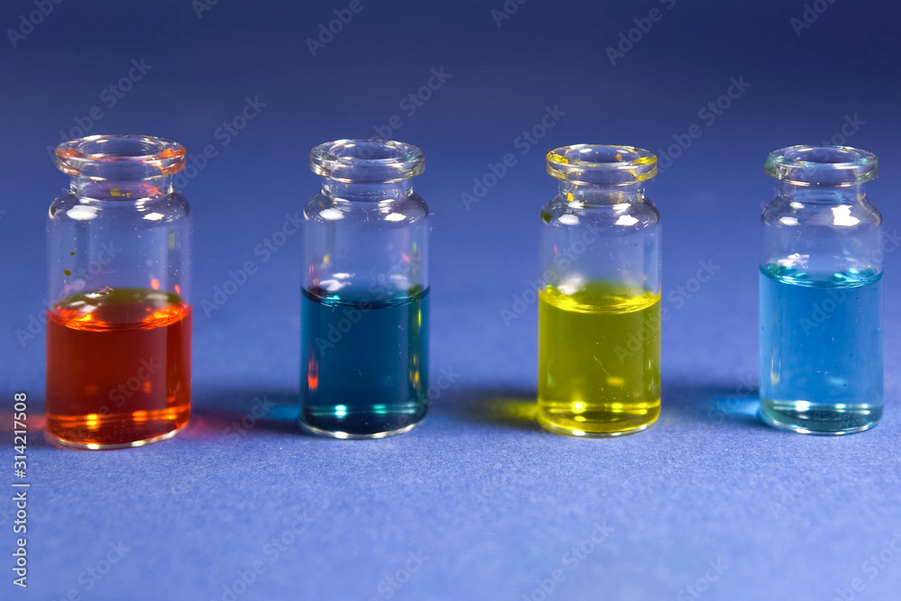 Multicolored liquids in glass vials Multicolored liquids in glass vials
