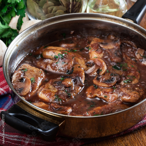 Delicious chicken marsala on frying pan