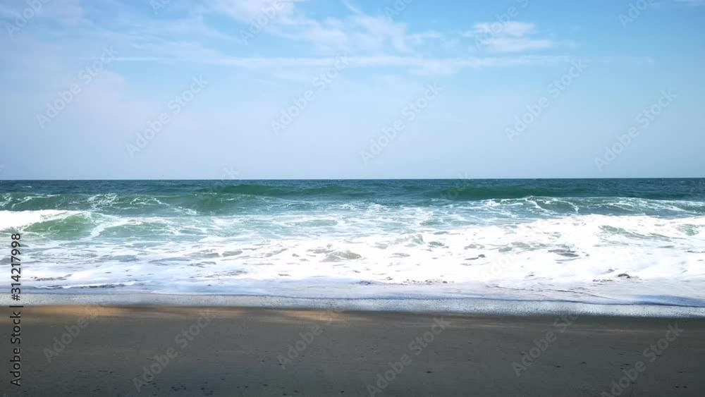 View of beach sea in the summer and strong waves washing the beach View of beach sea in the summer and strong waves washing the beach