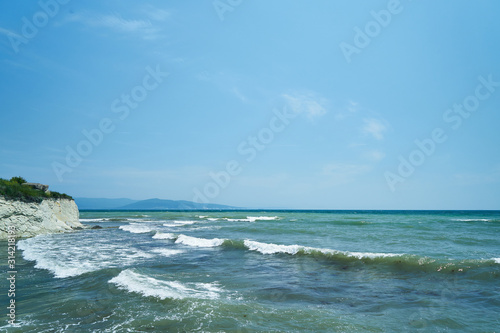 Fototapeta Naklejka Na Ścianę i Meble -  Image of the sea shore. The wave breaks on the stones.