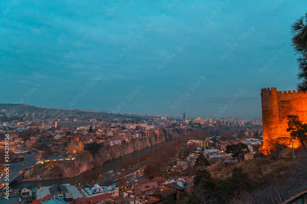 Tbilisi, Georgia, 15 December 2019 - view of Tbilisi from Narikala fortress at night with lighted lanterns