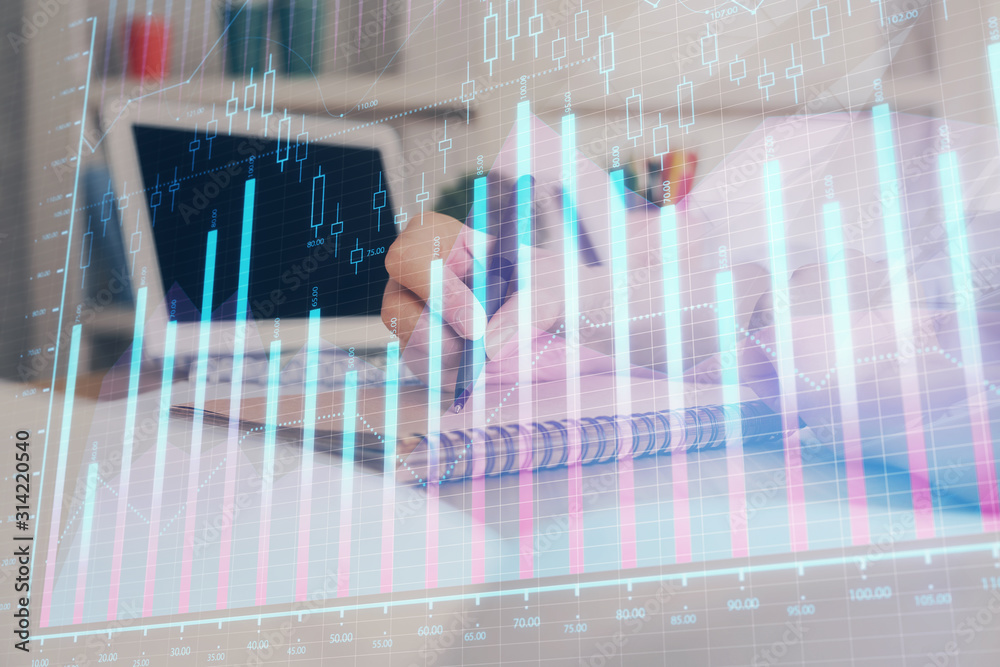 Financial graph displayed on woman's hand taking notes background. Concept of research. Double exposure Financial graph displayed on woman's hand taking notes background. Concept of research. Double exposure