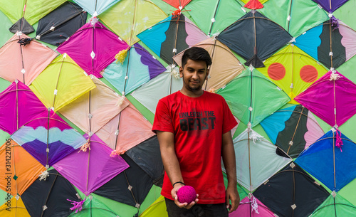 Young Man with Thread ball for makar sankranti. Makar sankranti is an Indian kite festival. It is also known as uttarayan photo