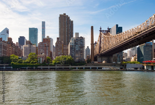 Queensboro Bridge in Midtown Manhattan with New York City skyline over East River