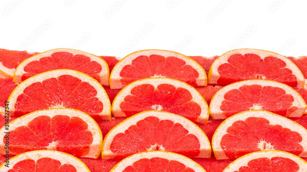 Grapefruit red juicy slices background. top view.