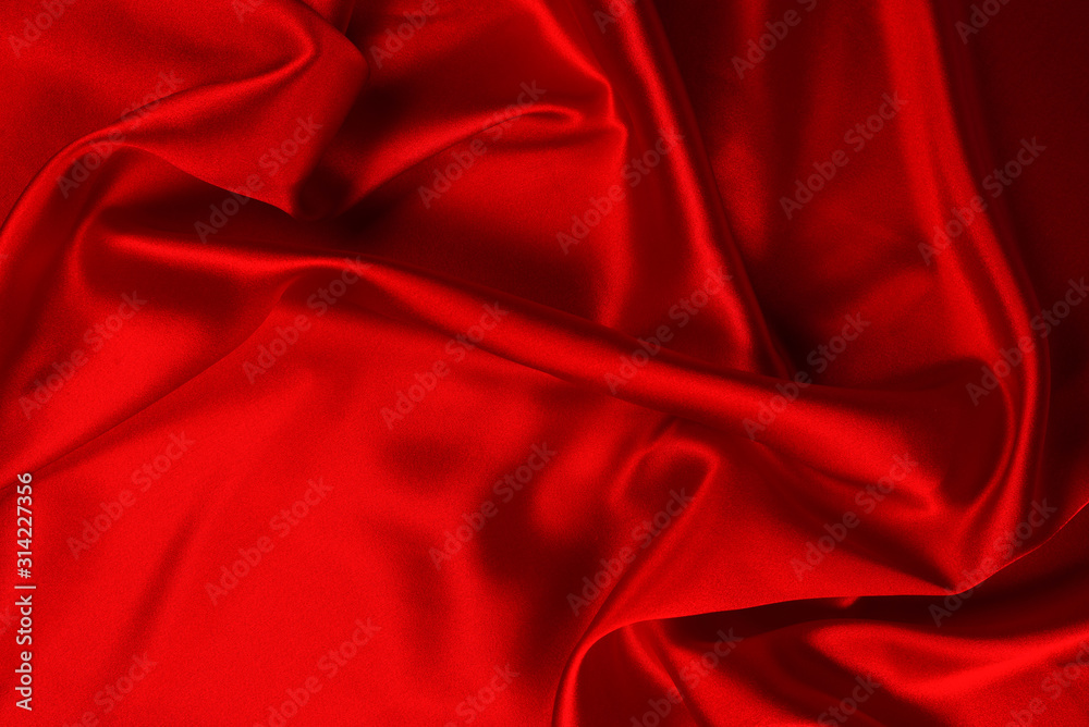 Red silk or satin luxury fabric texture can use as abstract background. Top view. Red silk or satin luxury fabric texture can use as abstract background. Top view.