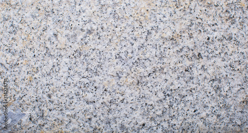 Granite texture, granite surface of stone. Closeup. Copy space.