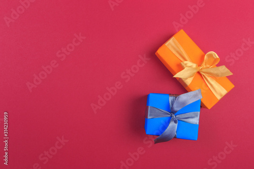 Different colored gift box on color background. Top view of various present boxes on minimal background. Birthday, Christmas, wedding, valentine, romantic gifts - Image © Fototocam