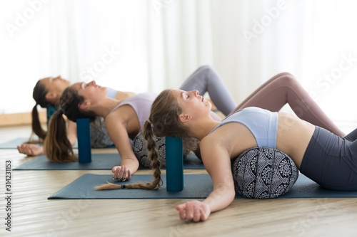 Fotografía Restorative yoga with a bolster