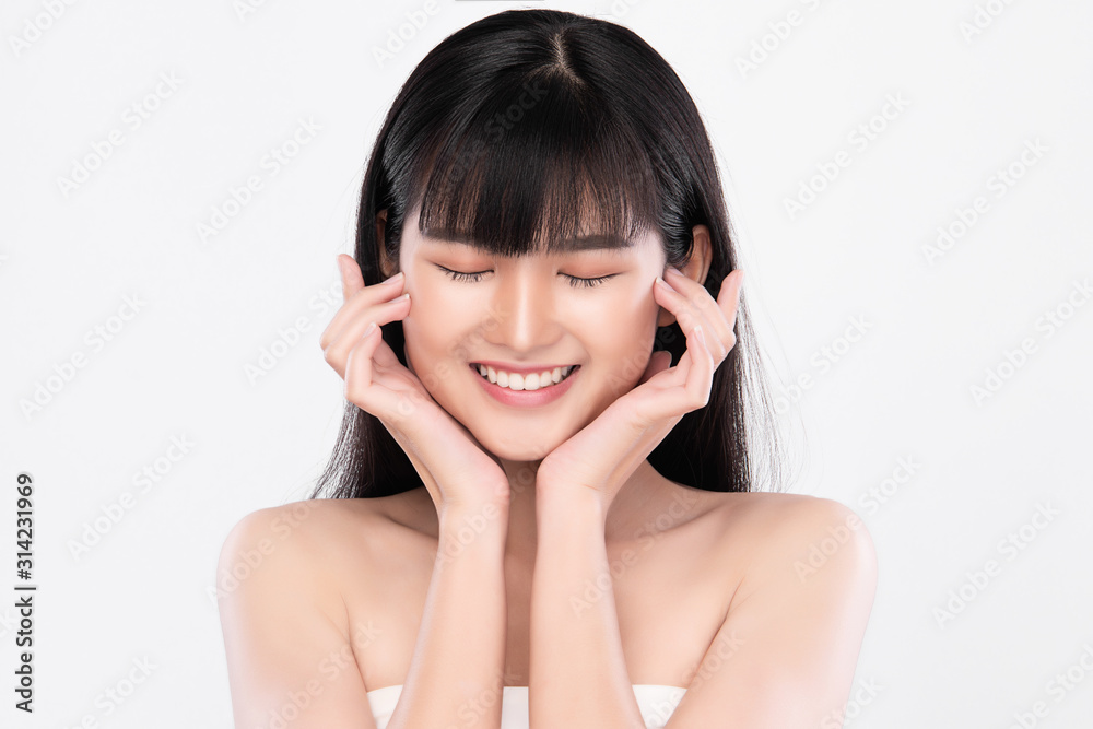 Beautiful Young Asian Woman with Clean Fresh Skin. Face care, Facial treatment, on white background, Beauty and Cosmetics Concept. Beautiful Young Asian Woman with Clean Fresh Skin. Face care, Facial treatment, on white background, Beauty and Cosmetics Concept.