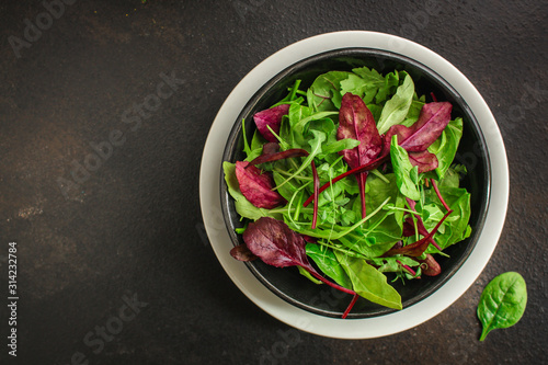 Healthy salad, leaves mix (mix micro greens, arugula, onion, other ingredients). food background. copy space