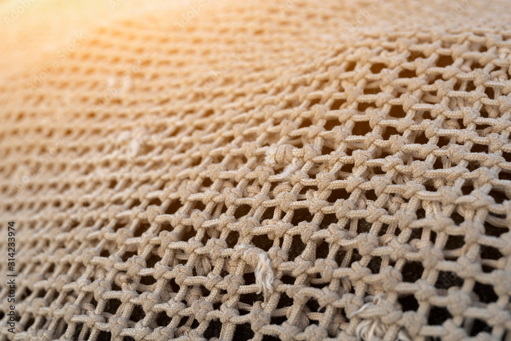 Close up view of fishing net in marine port in the morning. Selective focus. Blurred pattern background Close up view of fishing net in marine port in the morning. Selective focus. Blurred pattern background