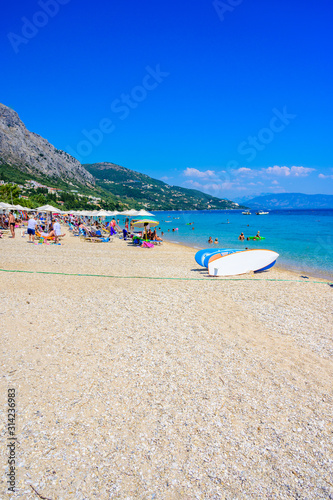 Fototapeta Naklejka Na Ścianę i Meble -  Barbati Beach with crystal clear azure water in beautiful landscape scenery - paradise coastline of Corfu island, Ionian archipelago, Greece.