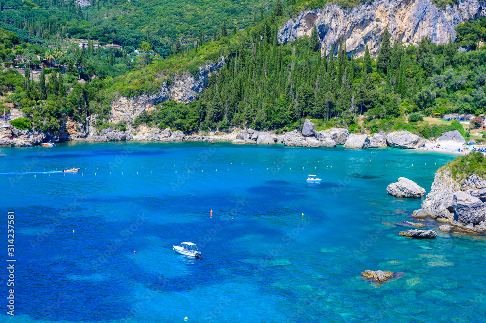 Paleokastritsa - Paradise coastline scenery with crystal clear azure water in Bay at white beach - Corfu, Ionian island, Greece, Europe