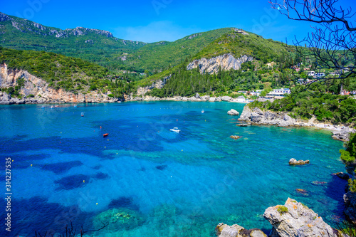 Paleokastritsa - Paradise coastline scenery with crystal clear azure water in Bay at white beach - Corfu, Ionian island, Greece, Europe