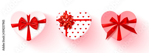 Set of heart-shaped gift boxes with red bow isolated on transparent background.Vector illustration