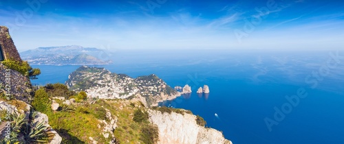 Aerial panoramic view of Capri Island and famous Faraglioni Rocks, Italy.