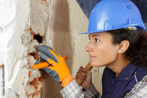 woman with hammer and chisel