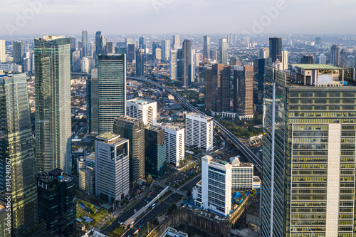 Aerial view of the modern Jakarta central business district along the Sudirman avenue with many corporate offices towers in Indonesia capital city