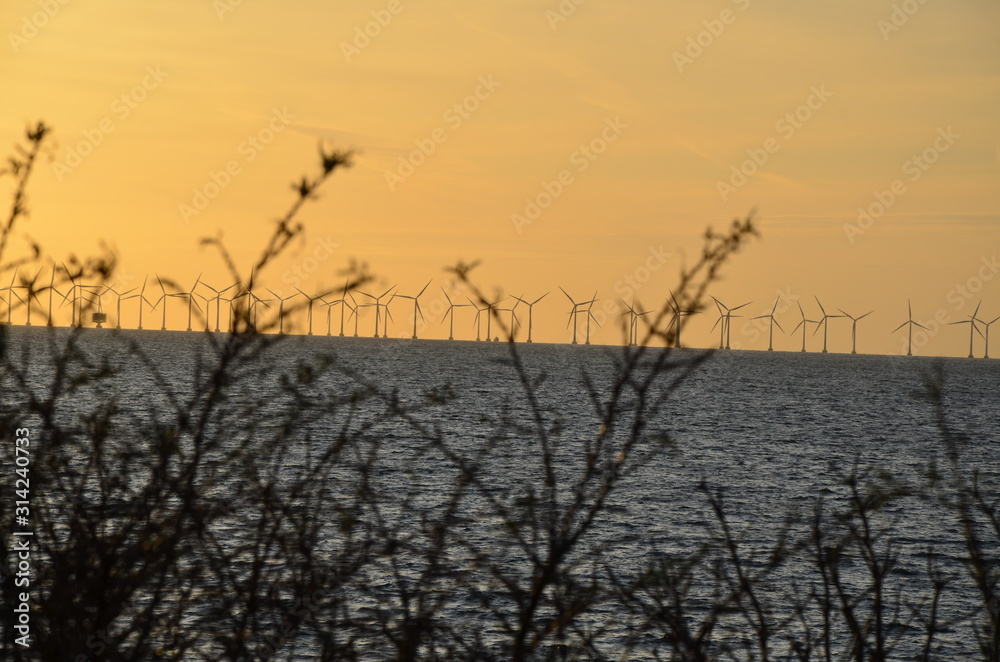 Windmills power plant, harvesting wind energy Windmills power plant, harvesting wind energy
