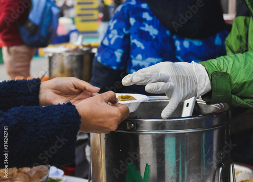 Stall owner serving pani puri 