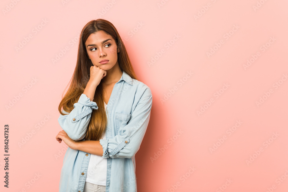 Young slim woman who feels sad and pensive, looking at copy space. Young slim woman who feels sad and pensive, looking at copy space.